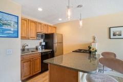 Spacious suite with sitting area and beach-inspired design at Glunz Ocean Beach Resort