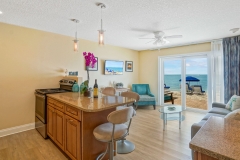 Spacious suite with sitting area and beach-inspired design at Glunz Ocean Beach Resort