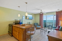 Spacious suite with sitting area and beach-inspired design at Glunz Ocean Beach Resort