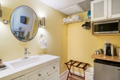Double queen bedroom with modern amenities and soft lighting at Glunz Ocean Beach Resort