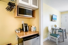 Double queen bedroom with modern amenities and soft lighting at Glunz Ocean Beach Resort