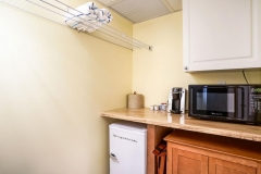 Double queen bedroom with modern amenities and soft lighting at Glunz Ocean Beach Resort