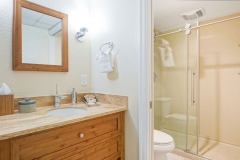 Standard king room with large windows and cozy furnishings at Glunz Resort